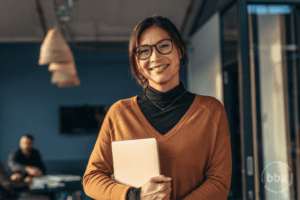 Woman with Glasses Rust Sweater Standing_Building Better Agents