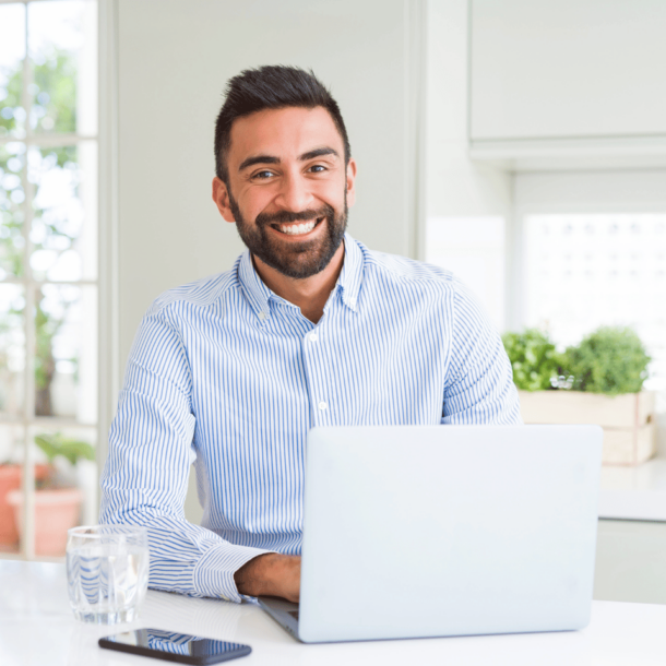 Real estate agent on laptop researching ways to find quality real estate leads