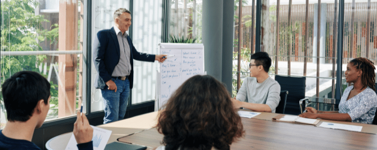 Real estate broker teaching pre-licensing class to aspiring Realtors
