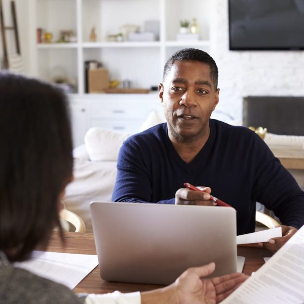 man-with-laptop-computer-giving-financial-advice-EXHCZMG
